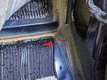Passenger side front near door, water seems to be coming from this spot, but may also be coming from an inch above this where the inside seal seems cracked.