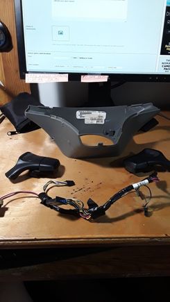 the plastic trim has some scratches but it will be between instrument cluster and back of steering wheel