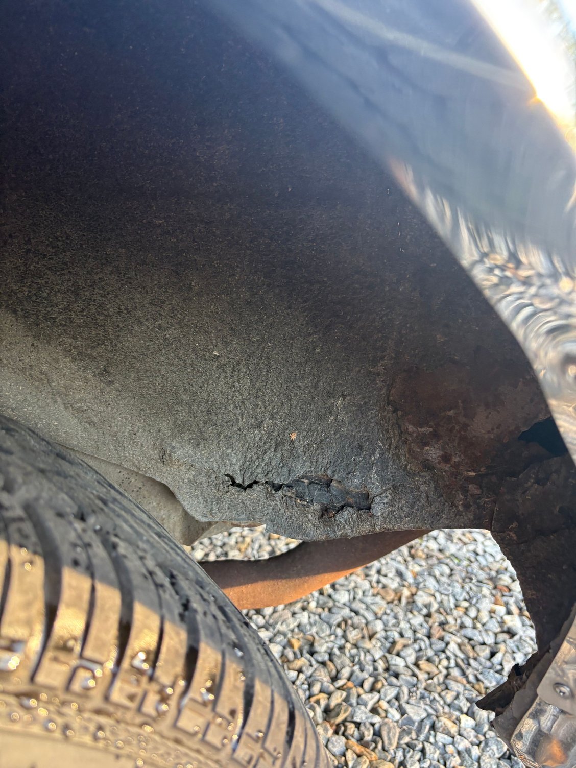 Rust spot in rear wheel well / trunk. 