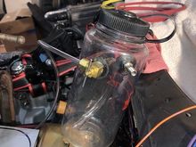 Close-up pic of the sport bottle; the pet cock has a short section of tubing that must remain submerged in brake fluid or else you'll push air into the master cylinder.  Fill the bottle about 1/2 full leaving 1/2 the bottle to fill with pressurized air.  The bottle cap must be tightly sealed to prevent the pressurized air from escaping.