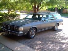 After a week, I got to clean it pretty well, put the wheel well trim back on, and removed the window trim with a steamer.  

Now, to strip the paint, add in the beltline trim, and go to wood 4 wagons to get the dark walnut trim installed...