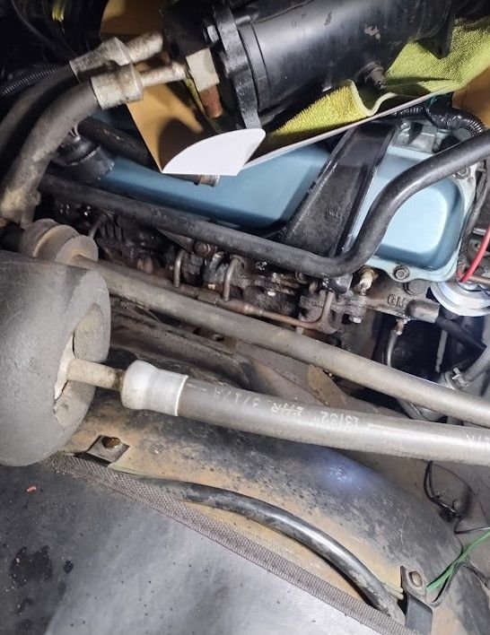 Manifold slides out the front once the bolts are removed.