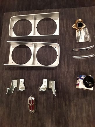 69 CUTLASS HEADLIGHT BEZELS $70, 442 REAR TAILPIPE HANGERS NEW $35, REAR SIDE MARKER USED $20,THERMOSTAT HOUSING WITH STAINLESS BOLTS(AFTERMARKET) NEW$10, VALVE COVER BREATHER  AC DELCO $15, REAR HOOD TRIM SOLD