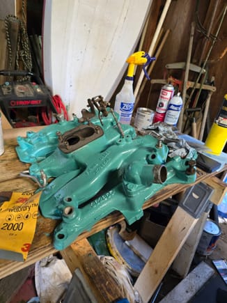 ...the intake manifold with a fresh coat of "low compression 394 green".