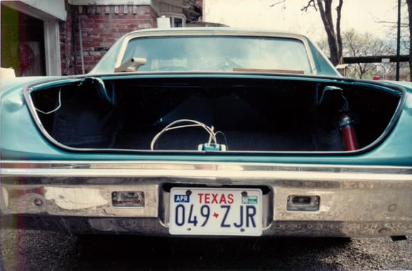 1990.  Different bumper installed at this point.