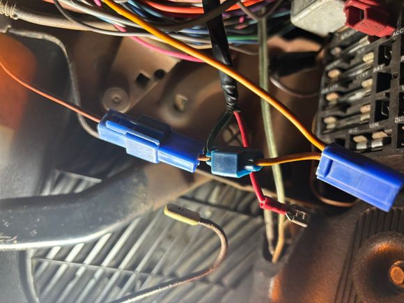 This is what was plugged into the fuse block in the battery and ign. Plugs.  The green and red wire I traced to added radio and speaker wires.  I can’t figure out where the orange wire came from.  Any ideas?