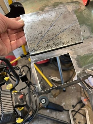This is the "recycled" sheet metal that was removed from the LH fender.  I looked good on the outside but was very pocked from rust on the backside.  When I started tacking it in place the MIG kept blowing through the thin metal.