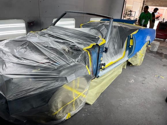 The car is in the spray booth now and the guys were masking off getting ready to spray the base coat.