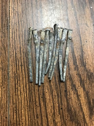 These nails are a minimum of 93 yrs of age. These are the type of solid lead nails used in the building industry during (at least prior to ~1935). They're still in excellent condition. No - I am not reusing them.