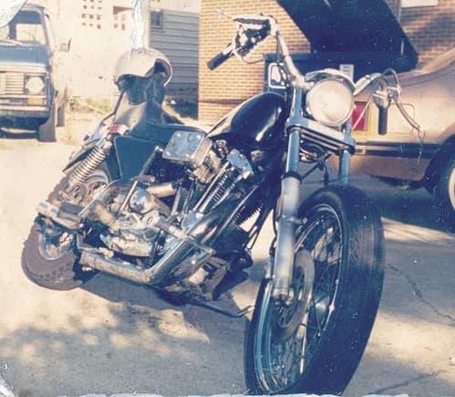 1987, my last bike b4 i broke my neck in 1990...i was still in the navy, norfolk, va...'79 hd sportster w/ [gloriously super loud] open shorty drag pipes... the only photo i have of my scooter, taken as it was parked because i broke the chain poppin' a wheelie moments before...the garter on my handlebars was a gift with a kiss from a pretty stripper at a local stripjoint for good luck...