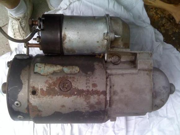 Original starter-note the hole for the brace/heat shield