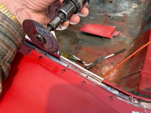 Touch area, with spot welds very close to the trunk frame that Crankit mentioned.  Used. Piece of aluminum sheet bent up as a protector.  Used a die grinder and cut off disk to grind welds down to where I could work them loose