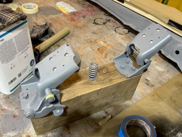 I just set the cap screws in the body hinge leaf, and will paint them together.  I am pretty sure I know how this was handled in factory.  I think the door with hinges already bolted on was attached to the car body, then the whole assembly was painted together. 
