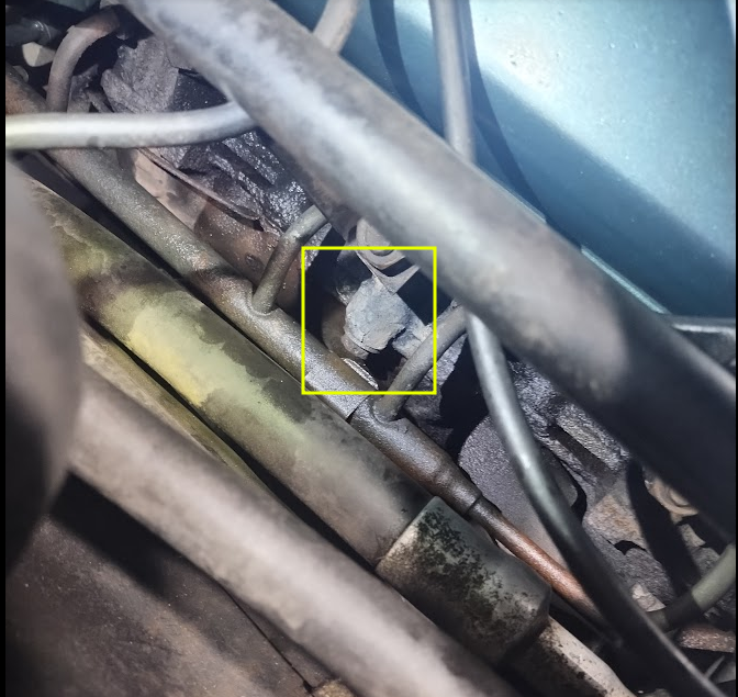 View of manifold center, blind, bolt from underhood.