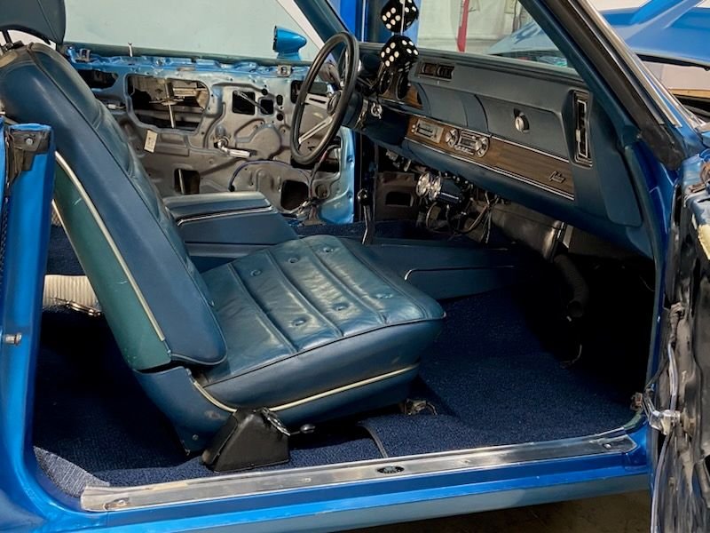 After I got the passenger side done, I put the seat in and bolted to w=two bolts up front down. I have the Year One seat mounts that offset them about 2 inches. That kind of messed with the flaps to cover the seat rails but when I re-install the seats, I'll deal with it then.