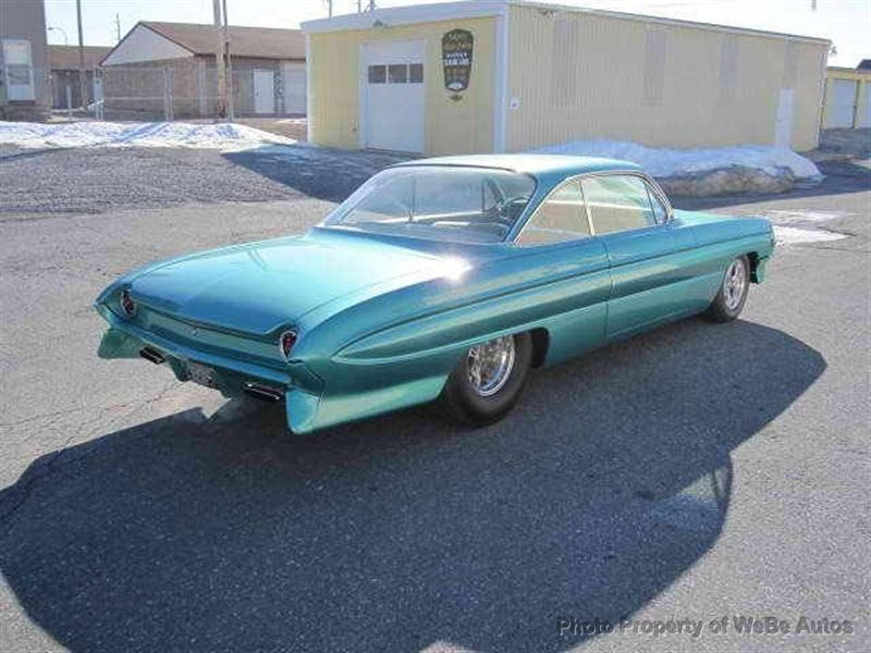 August 05 2016: Beautiful 1961 Chevy Impala with Candy Brandywine