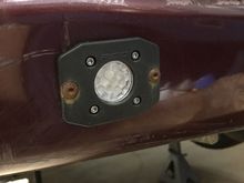 Here is the driver side light. I used black oxide bolts which was obviously a mistake. I will get around to replacing them one of these days. The red plastic is not very tight against the gray metal, so I used some washers in between the plastic and the metal to keep the bolts from sucking the plastic in in one spot.