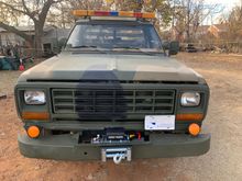 Front winch bumper off of an old Ford F-150 sporting a 12,000 lb. Winch from Harbour Frieght. 