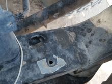 Lower radiator mount, drivers side. 1997 5.9 (360) Note the oblong hole. Passenger side extra hole is round.