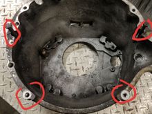 The top two circled bolts were a different diameter, and the bottom two holes did not line up with the dust cover on my replacement housing.