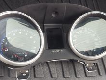 There are vertical white lines running down the EVIC on the right part of the screen.  The unit was very dirty and possibly just needs to be replaced.  I have seen pricing of $90 but I would more than likely snatch a cluster from a standard Durango or Jeep and install it.