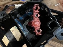 This is the backside of your actually headlight switch. This is very delicate to put together in fact the springs as you can see in the top middle go inside. There is a cylinder piece of copper that sits on those springs and has held in contact with a circuit board just through the entire component being put back together

A note here is the Durango does not use the bottom contact point so you will have to take out the screen in the contact from the old switch and put it in to the Durango switch