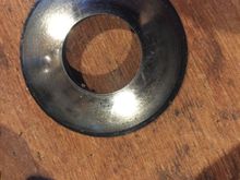 old washer on top of a new washer, see the difference in diameter, due to wear?