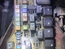 I thought originally the fuses were inside the cab and they were all working. Then when I got to the fuse box under the hood. You can see where the parking light fuse should be, there’s nothing. Someone has an inline fuse for the parking lights and every time I turn on the lights, it’s blowing that inline fuse. They’ll work for about 5 seconds but then the fuse will pop. 