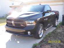 2013 black ram 1500 single cab R/T > dual flowmasters ex. w-resonators cutoff. 116 mi start of the journey.