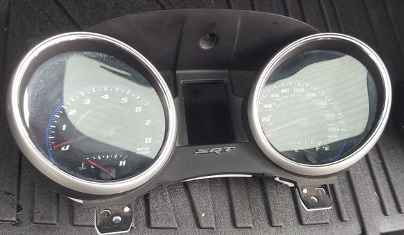 There are vertical white lines running down the EVIC on the right part of the screen.  The unit was very dirty and possibly just needs to be replaced.  I have seen pricing of $90 but I would more than likely snatch a cluster from a standard Durango or Jeep and install it.