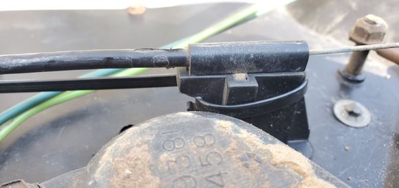 The tab broke due to age; I zip tied it back on to keep it from walking free after assembly.