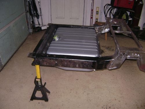 22 gallon gas tank. Its mounted from underneath so I can remove it without pulling the bed.