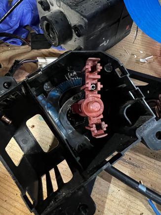 This is the backside of your actually headlight switch. This is very delicate to put together in fact the springs as you can see in the top middle go inside. There is a cylinder piece of copper that sits on those springs and has held in contact with a circuit board just through the entire component being put back together

A note here is the Durango does not use the bottom contact point so you will have to take out the screen in the contact from the old switch and put it in to the Durango switch