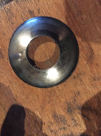 old washer on top of a new washer, see the difference in diameter, due to wear?