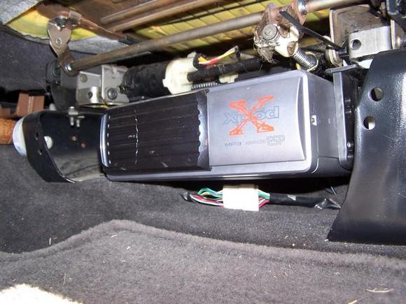 Sony 10-disc CD changer mounted under driver's seat.
