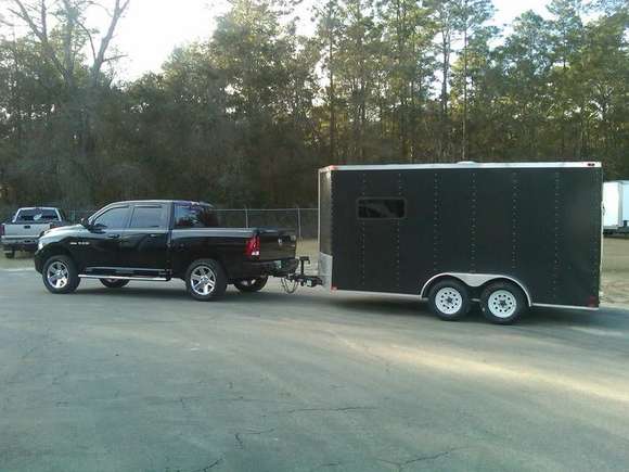 Truck with lift, hooked up to my empty trailer.