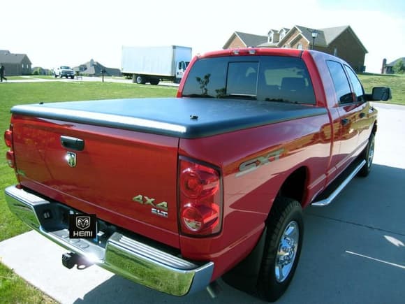 Undercover tonneau, great cover...lockable (cannot open tailgate when locked too) and water tight thus far.  Superlight...It doesn't even weigh 50lbs and comes off very easy.  Also in the pic is my rear view cam beside the liscense plate...a must on such a long truck, very handy.