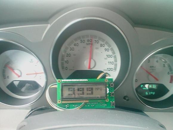 This is a picture of the 2008 Avenger in fuel cutoff while going down a hill between Layton and Park City, UT.  As you can see, the engine is turning about 2k rpms, we are going 65 mph, and the OBDuino (like a scangauge) is indicating 999 mpg!