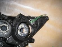 5. after you get the strip position where it needs to go. Feed the wires through the hole where the previous clearance bulb attached to the headlight. completely cut off the clearance bulb and use those wires to power your new clearance strip!
