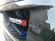custom carbon fiber grill with nismo badge and comb mesh grill.