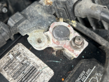 Obviously the negative terminal.  The post was cleaned for sure, but the positive terminal is cleaner.