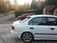 the car before the spoilerking rear roof spoiler and before the 225/50R16 michelin's. the skirts are painted though but the 99 rear bumper and spats arent on and the top1 motors skirts just got in. so pics soo for that.
