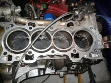 Piston went up and hit the head and seized on its way down.
Was a rich tune so no signs of detonation..
Literally just blew up from pressure.

I have not taking it fully apart yet too see if it snapped ffom coolant or not.