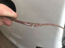 This was the + wire they had going to the fuel pump. It was pinched between the fuel tank and bottom of the trunk, just about worn thru.  So I replaced it and rerouted around the tank. 