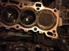 Oil gallery, that weird shaped hole on the engine block bottom right corner. Piece of the broken head fell in there .