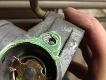 Clamp the channel locks (Pliers) around one of the remaining screws and start turning counter clockwise to relieve the screw. Should end up with something like this.