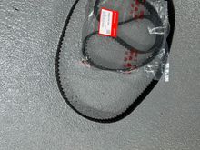 Old timing belt and new OEM timing belt still in the package
