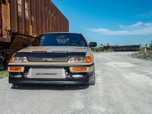 the far right top and far left top opening. a front splitter rod going up through that area may make it grow on me more.