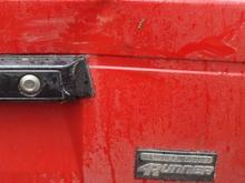 My B/F backed into a tree when we were out muddin'.  It's the first and only dent.