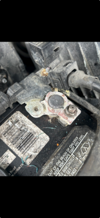 Obviously the negative terminal.  The post was cleaned for sure, but the positive terminal is cleaner.